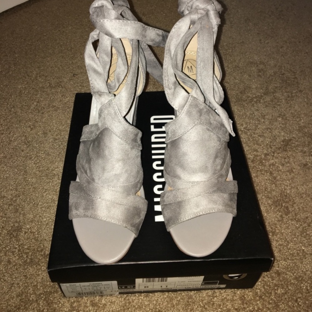 Grey faux suede tie up block heels.
